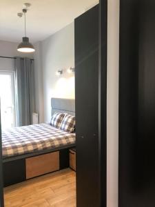 Uma cama ou camas num quarto em Property Apart - Soft Lofty Legnicka Centrum