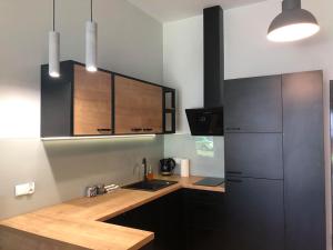 A cozinha ou kitchenette de Property Apart - Soft Lofty Legnicka Centrum
