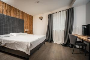 Postel nebo postele na pokoji v ubytování Hotel San Giacomo Spa&Gourmet