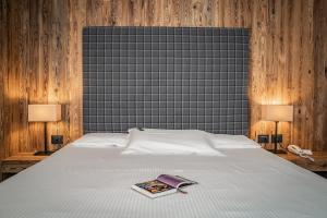 Postel nebo postele na pokoji v ubytování Hotel San Giacomo Spa&Gourmet