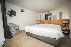 Postel nebo postele na pokoji v ubytování Hotel San Giacomo Spa&Gourmet