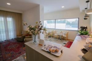a living room with a table with a tray of food at Piccolo Hotel in Palosco