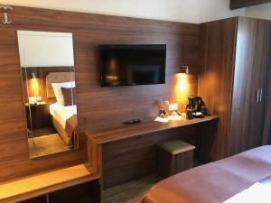 Postel nebo postele na pokoji v ubytování Hotel Post