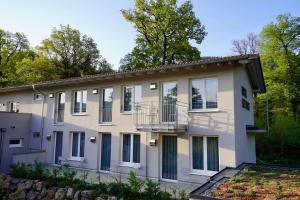 an exterior view of a building with a balcony at Busses Guesthouse in Freiburg im Breisgau