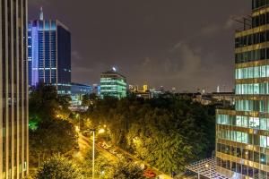 a city skyline at night with skyscrapers at Hotel Best Western City Centre in Brussels