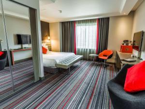 Postel nebo postele na pokoji v ubytování Pullman London St Pancras