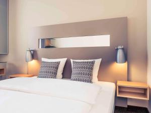 Postel nebo postele na pokoji v ubytování Mercure Hotel Düsseldorf City Nord