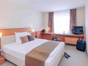 Postel nebo postele na pokoji v ubytování Mercure Hotel Mannheim am Rathaus + 37 fotografií
