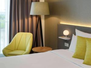 Postel nebo postele na pokoji v ubytování Novotel München Messe