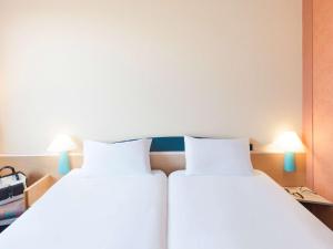 Letto o letti in una camera di ibis Luxembourg Sud
