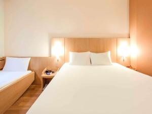 Tempat tidur dalam kamar di Ibis Bilbao Centro