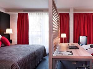 Ein Bett oder Betten in einem Zimmer der Unterkunft Mercure Biel