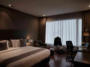 Krevet ili kreveti u jedinici u okviru objekta Pullman Kuching