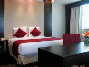 Giường trong phòng chung tại Novotel Riyadh Al Anoud