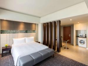 Postel nebo postele na pokoji v ubytování Grand Mercure Shanghai Hongqiao + 37 fotografií