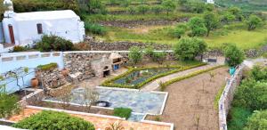 an aerial view of a garden and a house at St.George Valsamitis in Katapola