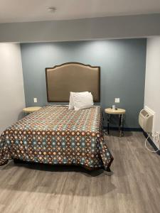 Ένα ή περισσότερα κρεβάτια σε δωμάτιο στο Motel 66 Los Angeles