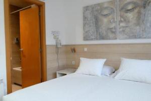 Posteľ alebo postele v izbe v ubytovaní Hostal House