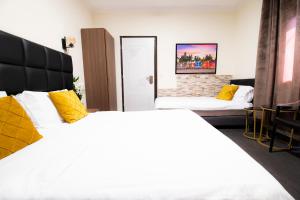 מיטה או מיטות בחדר ב-מלון מיאמי ביץ תל אביב