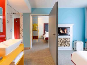 Postel nebo postele na pokoji v ubytování ibis Styles Hotel Berlin Mitte