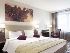 Кровать или кровати в номере Mercure Hotel Brussels Centre Midi