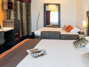 Postel nebo postele na pokoji v ubytování Mercure Lyon Centre - Gare Part Dieu