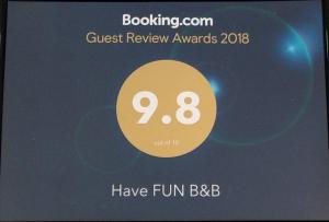 a poster for the guest review awards with the number eight at Have FUN villa in Hengchun South Gate