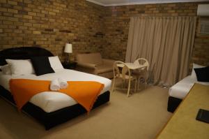 Magdala Motor Lodge & Lakeside Restaurant客房内的一张或多张床位