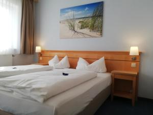 Postel nebo postele na pokoji v ubytování Hotel Nummerhof