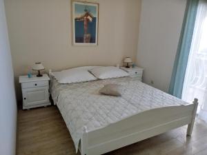 Postel nebo postele na pokoji v ubytování Tihana
