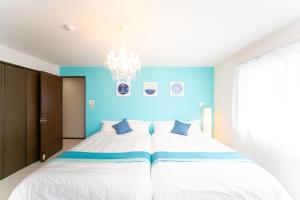 Postel nebo postele na pokoji v ubytování Awaji Seaside Resort in Ikuha + 41 fotografií