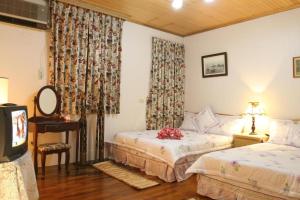 Cama o camas de una habitación en Yilan Affectivity