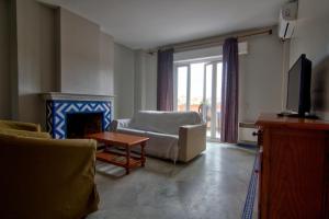Televízia a/alebo spoločenská miestnosť v ubytovaní Apartamentos Aloha2 El Puerto de Santa Maria