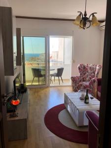 a living room with a couch and a chair and a table at Casa Alea in Ulcinj