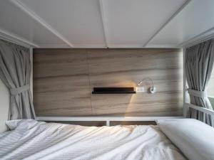 Postel nebo postele na pokoji v ubytování Light Inn