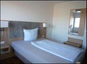 Postel nebo postele na pokoji v ubytování Hotel - Restaurant Veldscholten