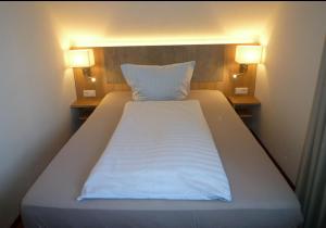 Postel nebo postele na pokoji v ubytování Hotel - Restaurant Veldscholten