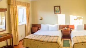 Cama ou camas em um quarto em Hotel Belsol