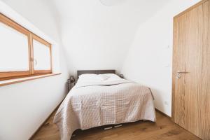 Postel nebo postele na pokoji v ubytování Weingartenrefugium Rosenberg