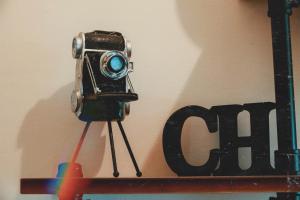 a camera sitting on a shelf next to a sign at 墾丁辰居親子包棟民宿 in Hengchun