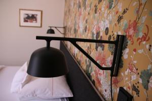 Postel nebo postele na pokoji v ubytování Hotel am Torturm