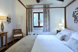 A bed or beds in a room at La Panoramica Gubbio - Maison de Charme - Casette e appartamenti self catering per vacanze meravigliose!