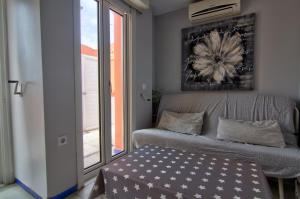 Posteľ alebo postele v izbe v ubytovaní Apartamentos Aloha2 El Puerto de Santa Maria