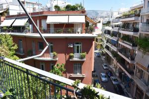 a view from the balcony of a building at Katzen Room by the Metro in Athens