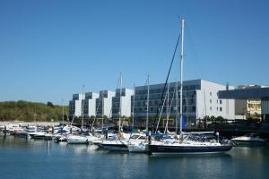 a group of boats are docked in a harbor at Troia Residence by The Editory - Apartamentos Marina in Troia