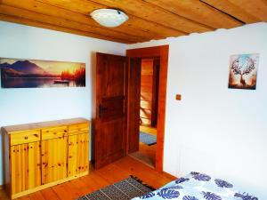 A bed or beds in a room at Zrub Liptovec
