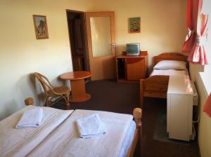 Postel nebo postele na pokoji v ubytování Penzion Na Prachárně