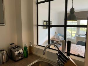 Kuchyň nebo kuchyňský kout v ubytování Sylthaus Appartement