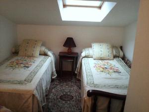 Postel nebo postele na pokoji v ubytování Ático Duplex Silgar