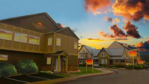 a row of houses with a sunset in the background at Sunrise Inn in Anacortes